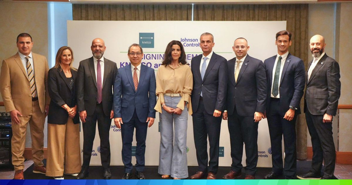 Senior leadership of KNETCO and Johnson Controls posing at a ceremony in Kuwait City