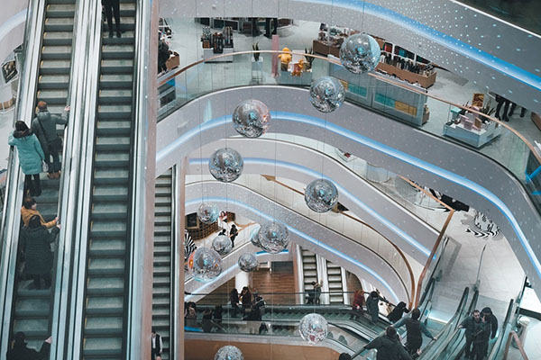 Low angle shot of inside a shopping mall with escalators