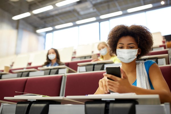 Woman sitting on a class looking mobile phone