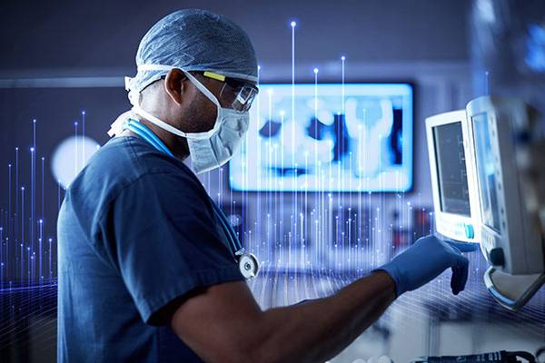 A surgeon operating a device in an emergency room